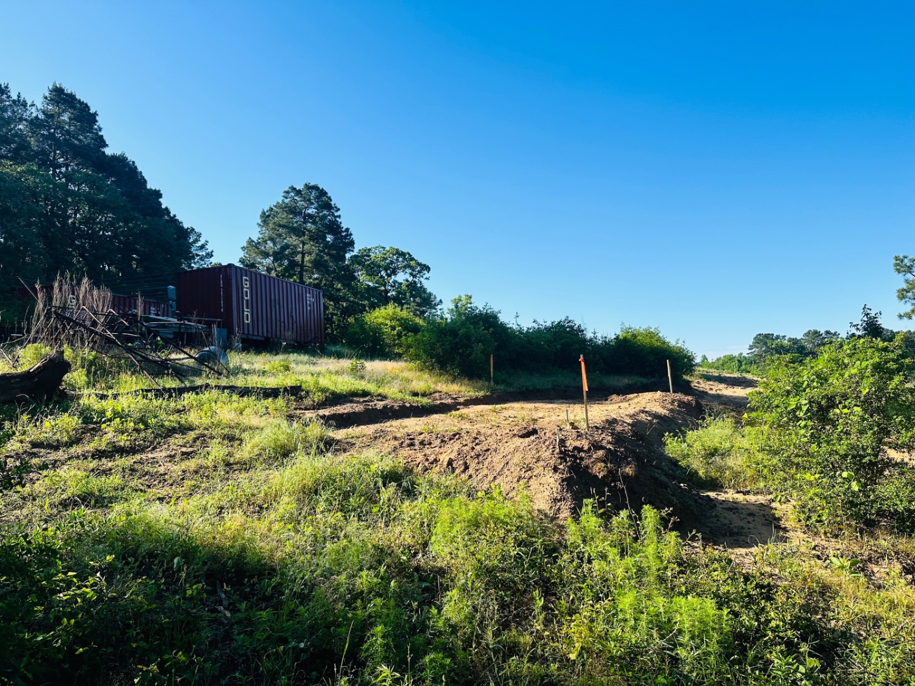 Acreage being cleared and rough-graded for site work