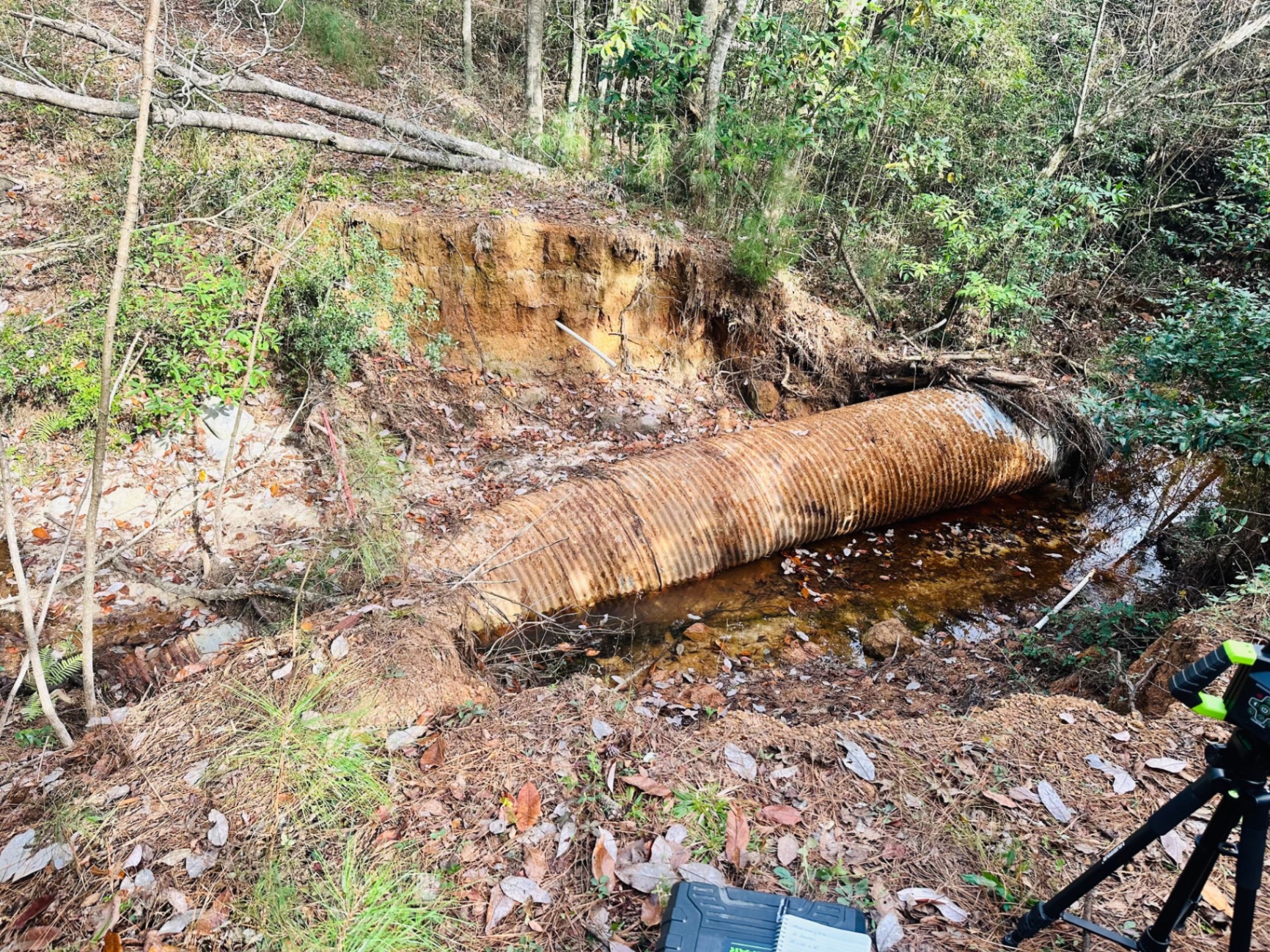 Large corrugated culvert pipe set at eroded bank